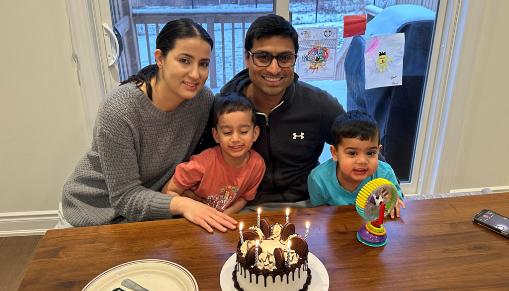 Candid photo of Adil and his family celebrating a birthday.